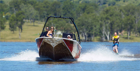 small red aluminium quintrex freestyler boat suitable for a general water activities